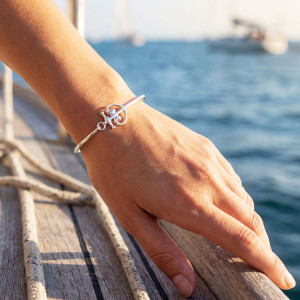 Sterling silver anchored heart bracelet on hand