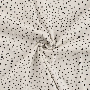 Scattered Black Polka Dots on Ivory Cotton Lycra Knit Scattered Black Polka Dots on Ivory Cotton Lycra Knit