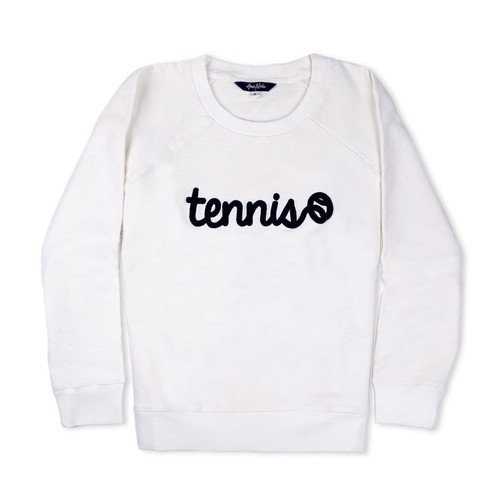 White womens sweatshirt lays flat on white background. There is navy text that reads tennis in a cursive font across front