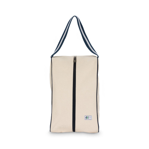 rectangular tan canvas shoe bag with navy handles.