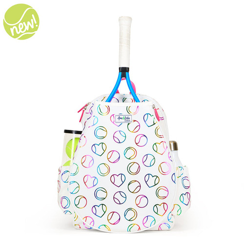 White kids tennis backpack with hot pink zippers and metallic rainbow tennis balls and hearts printed on the fabric.