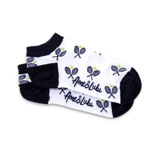 Pair of womens socks in white with navy trim, heel and toes. There are navy crossed racquets and lime tennis balls stitched on the socks
