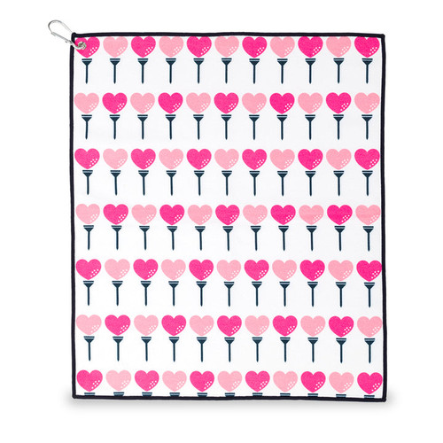 small white towel with hot pink and pink heart shaped golf balls and tee