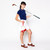 woman holds golf club and tan canvas small drawstring pouch with red trim.