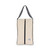 rectangular tan canvas shoe bag with black handles.