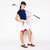 woman holds golf club and tan canvas small drawstring pouch with red trim.