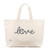 Canvas large tote with the front embroidered with the word love in a navy cursive font