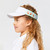 Little girl wearing light green kids visor with pink tennis ball ice creams on the sides.