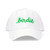 White baseball hat with the word birdie embroidered on the front in a green cursive font