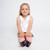 girl wearing pair of navy kids socks with pink heel and toes with heart and tennis ball pattern stitched on sock