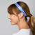 Woman wears A blue and white striped headband with a black elastic band.