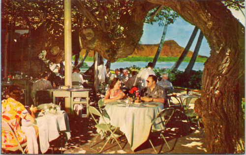 Halekulani Hotel - Couple Dining on Coral Lanai with Hau Trees and Diamond Head