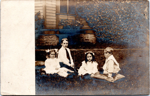 RPPC Sailboat - children in nice clothes sitting on lawn