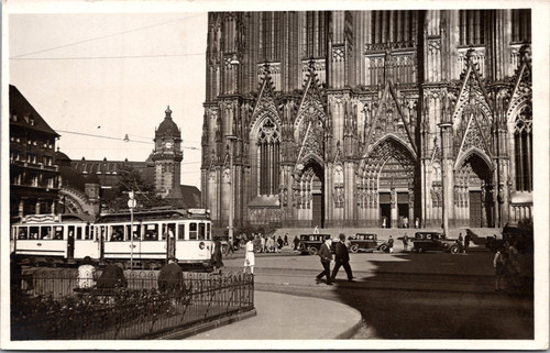 Cologne Cathedral (Kölner Dom) with tram and people in foreground