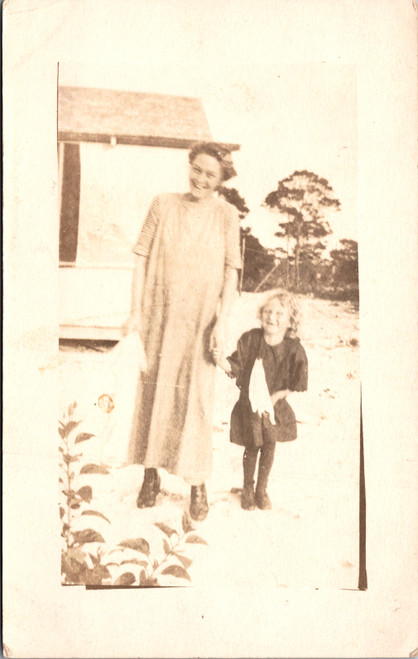 Woman and child holding hands