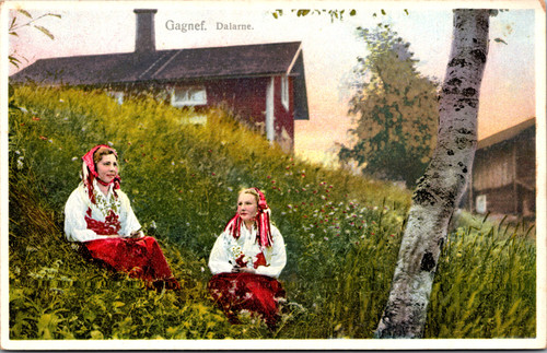 Gagneff Dalarna Sweden  Two women in traditional folk dress sitting in grass