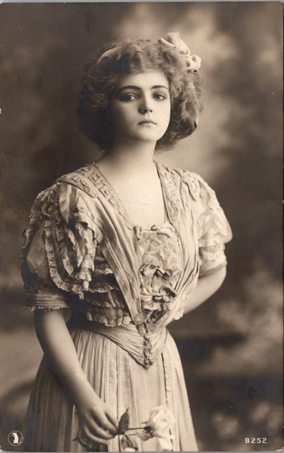 Woman with rose and ribbon in hair