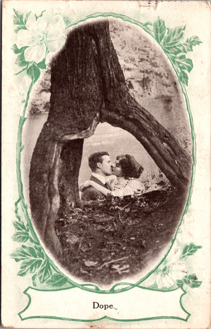Dope - view of couple kissing through stump Dope - view of couple kissing through stump