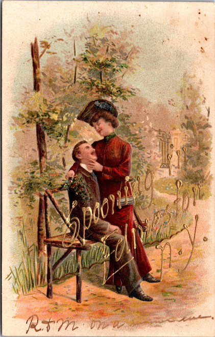 Embossed 1908 postcard titled Spooning in Edmeston NY showing Edwardian couple courting on bench with gold gilt lettering printed in Germany
