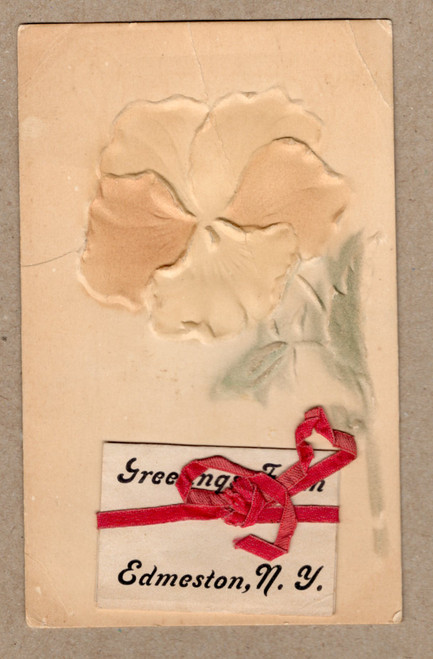 Embossed vintage postcard showing tan pansy with real red ribbon and greeting Greetings from Edmeston N.Y.