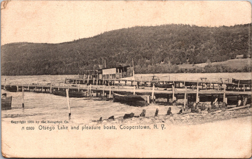 1905 Rotograph postcard of Otsego Lake in Cooperstown New York showing wooden docks and pleasure boats.