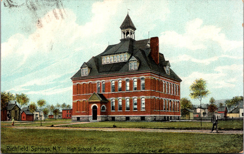 Postcard showing the High School Building in Richfield Springs New York large brick structure with mansard roof and bell tower.
