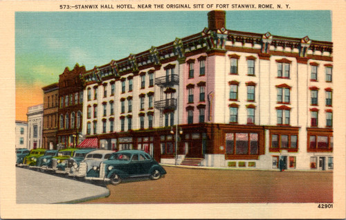 Linen postcard view of Stanwix Hall Hotel in Rome New York with 1930s cars and storefronts