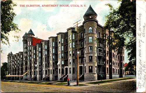 Olbiston Apartment House in Utica New York with round towers and long façade, early color postcard.