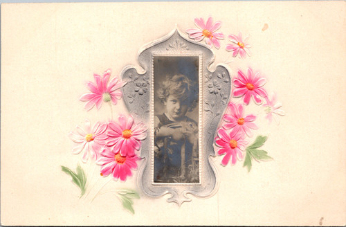Antique embossed postcard with child portrait and hand tinted floral design