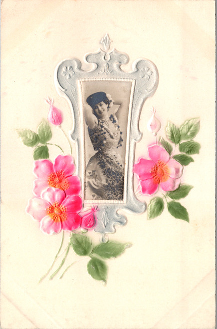 Antique embossed postcard with woman portrait and hand tinted floral design