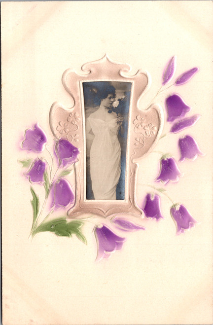Antique embossed postcard with woman portrait and hand tinted floral design