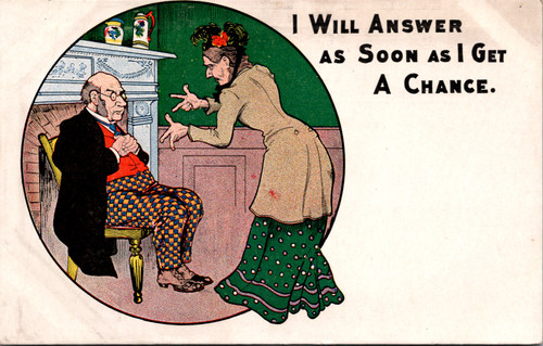 Woman scolding a man sitting in front of a fireplace