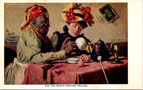 women at table reading tea leaves