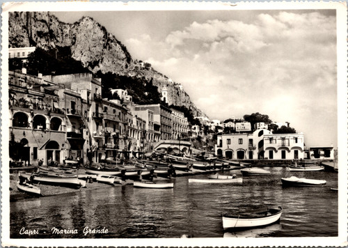 Vintage black and white postcard showing Marina Grande harbor in Capri Italy with boats and hillside buildings