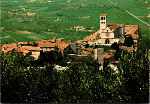 Vintage color postcard showing the Basilica of Saint Francis in Assisi Italy overlooking the Umbrian countryside