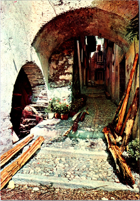 Vintage postcard of stone archway and cobblestone alley on Isola Pescatori Italy