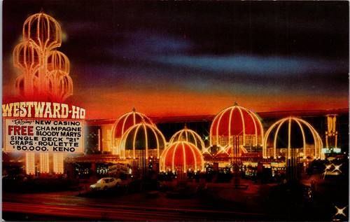 Westward Ho Casino Las Vegas Nevada at night with neon lights vintage postcard