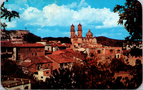 Vintage postcard of Taxco Mexico showing Santa Prisca church and hillside village from Hotel Rancho Telva