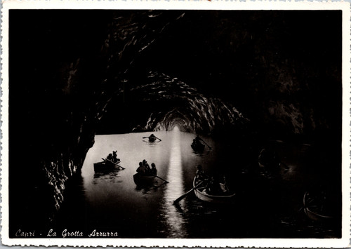 Real photo postcard of La Grotta Azzurra Blue Grotto Capri Italy with boats inside cave