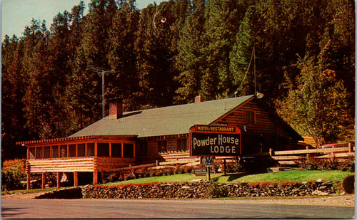 Vintage chrome postcard showing Powder House Lodge motel and restaurant in Buckeye Gulch South Dakota near Mt Rushmore