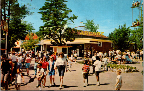 Vintage chrome postcard showing the Arcade building and midway crowd at Canobie Park in Salem New Hampshire