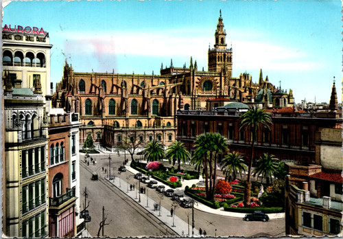 Vintage postcard of Sevilla Spain showing Cathedral and Casa de la Lonja with gardens