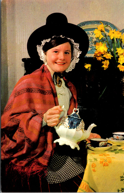 Vintage postcard Welsh National Costume woman in traditional dress pouring tea