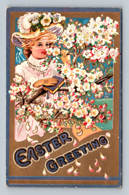 Antique embossed Easter postcard showing woman with floral hat holding book among spring blossoms