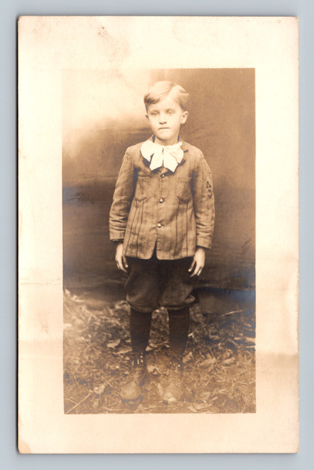 rppc boy portrait edwardian child large bow tie real photo postcard
