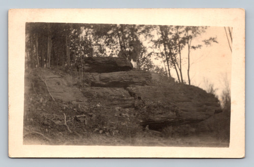 rppc couple standing on rocky ledge