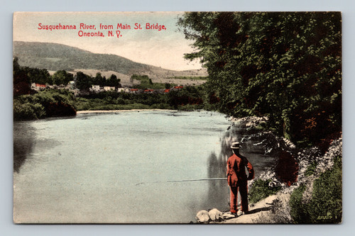 Man fishing from the shore along susquehanna river in oneonta ny