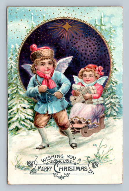 Angel children pulling sled snowy winter scene vintage Christmas postcard