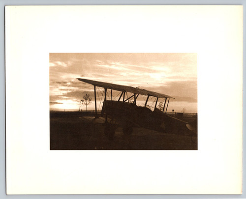 Vintage photograph biplane silhouette sunset aviation image