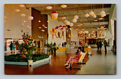woman seated on bench at Escondido shopping mall